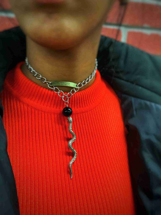 a close up of a person wearing a red sweater.