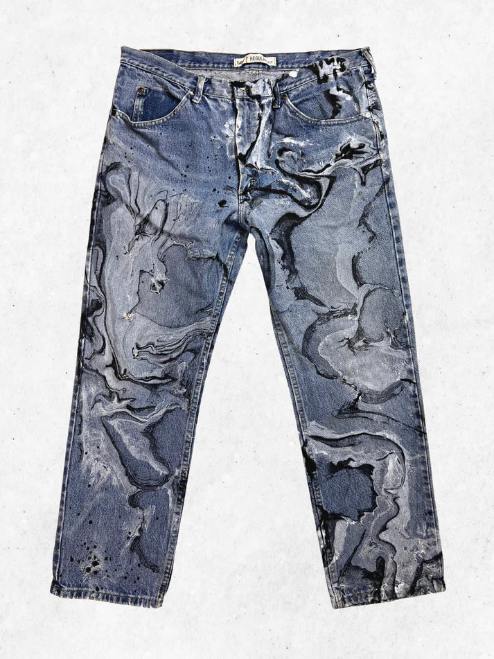 A pair of jeans with a black and white pattern.