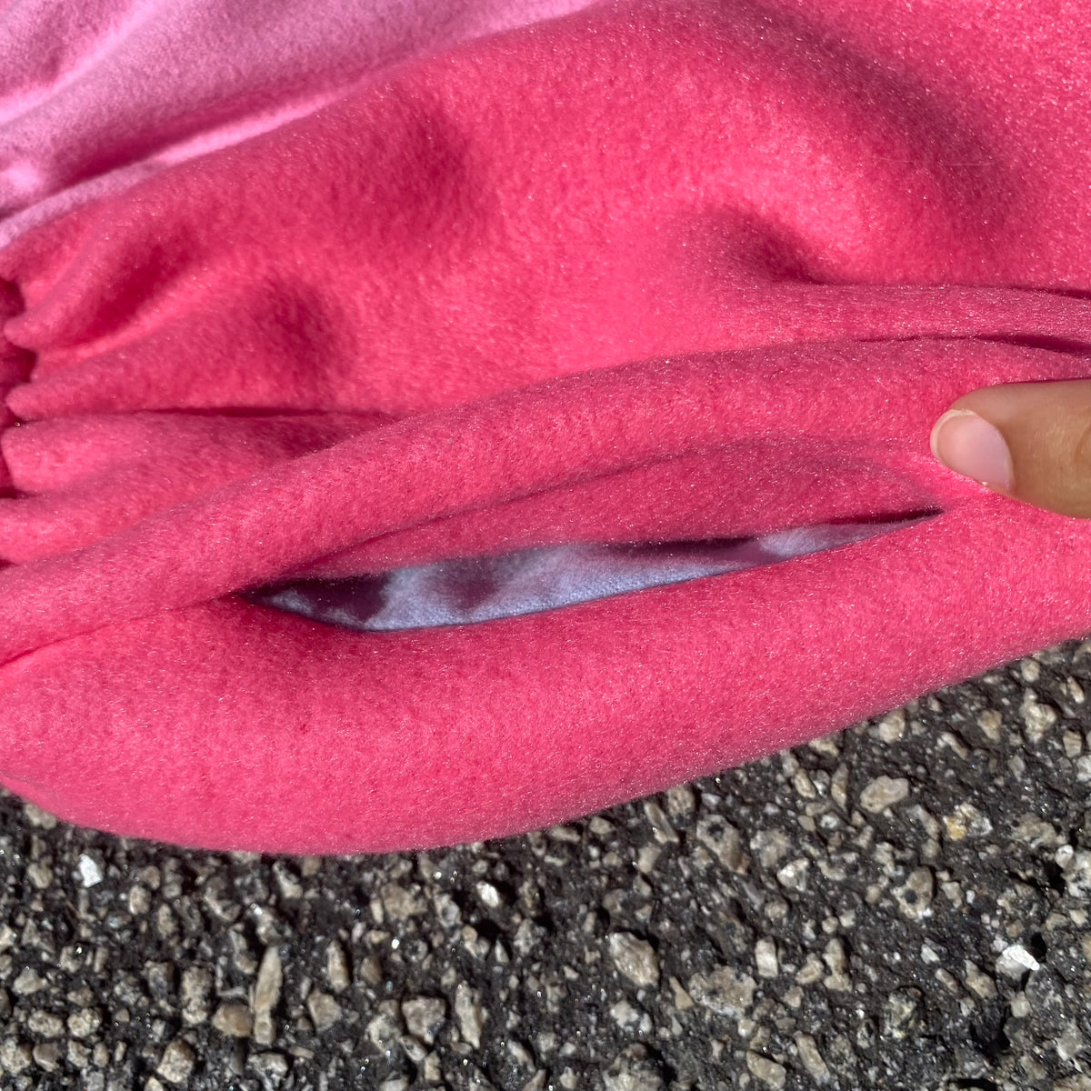 A person is wearing Cotton Candy Nike Shorts on the ground.