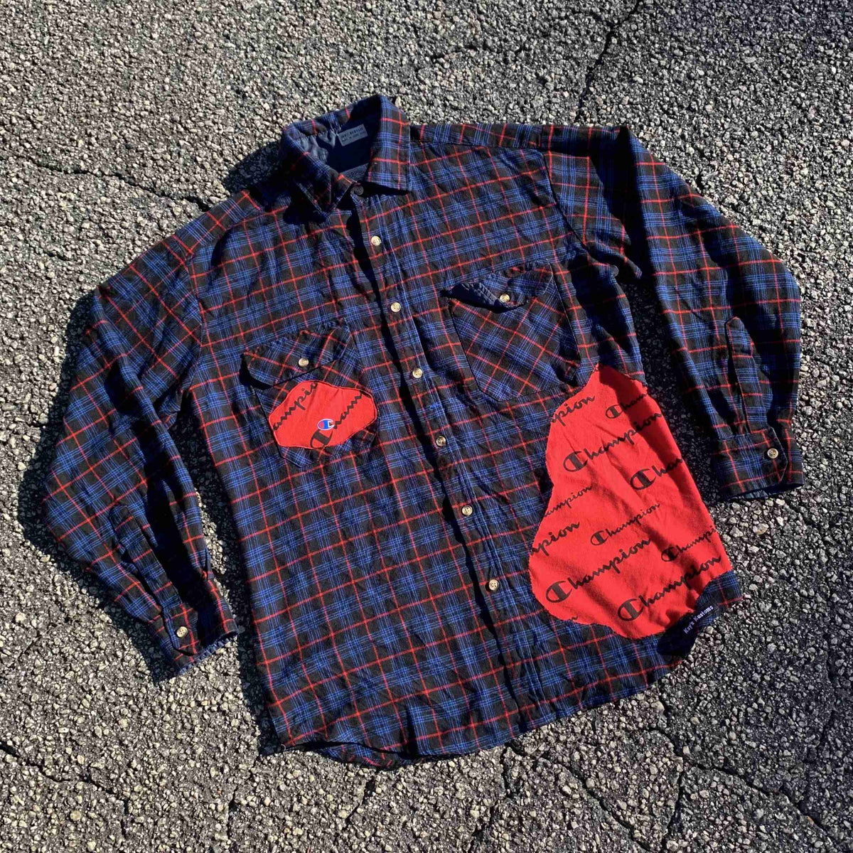 a plaid shirt with a red heart on it.
