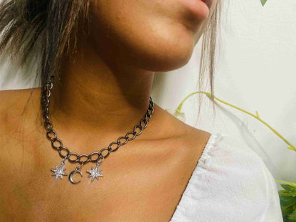 a close up of a woman wearing a necklace.