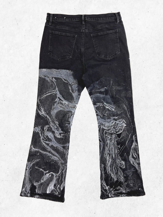 A pair of black jeans with a black and white print.