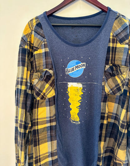 a women's blue moon t - shirt hanging on a hanger.