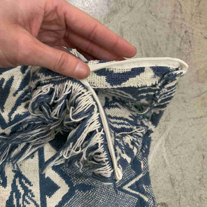 a hand is holding a piece of fabric.
