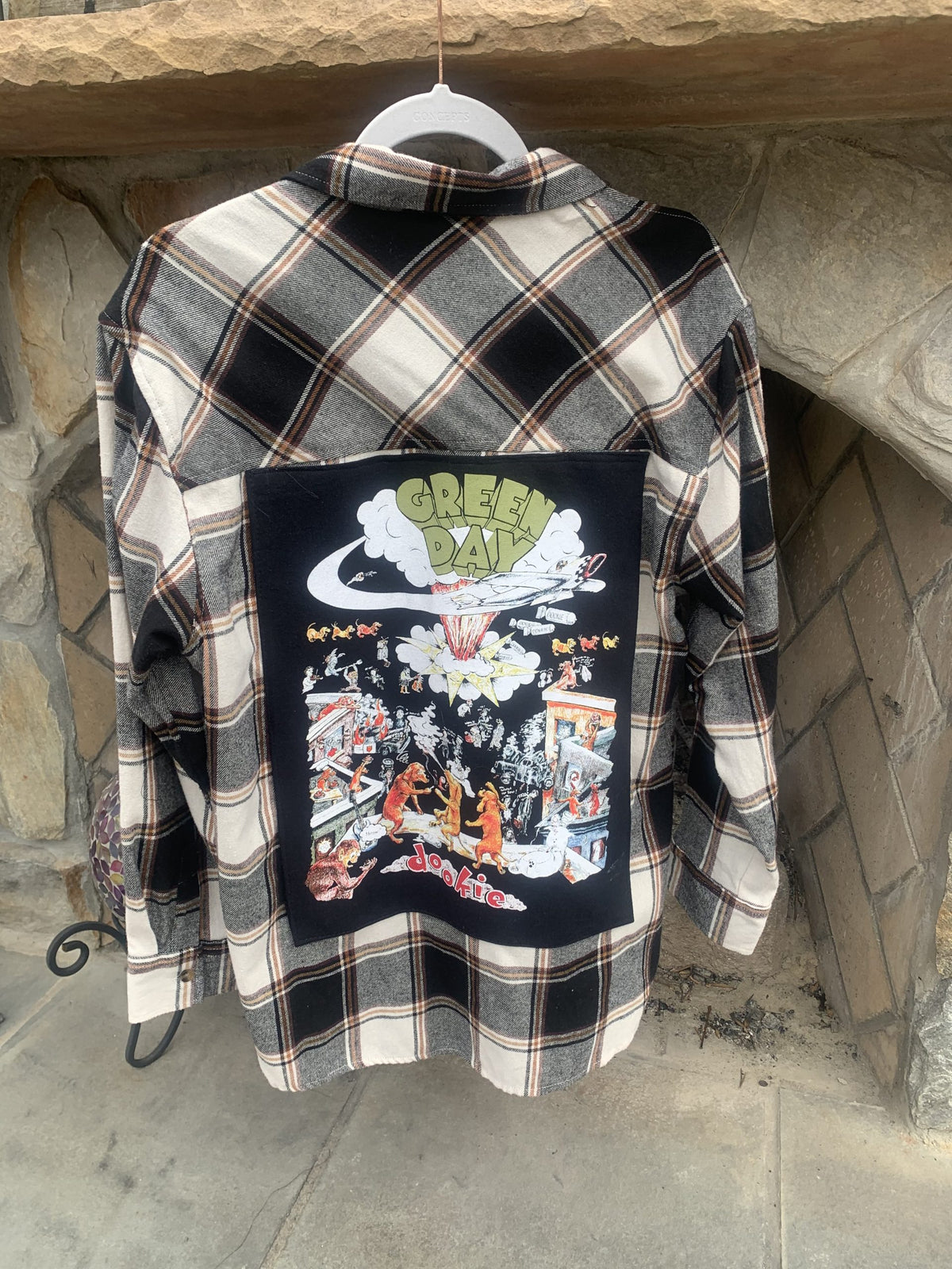 A Green Day flannel shirt with a picture of a dragon on it.