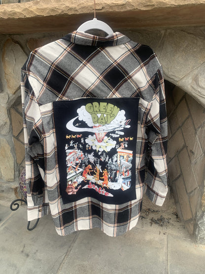 A Green Day flannel shirt with a picture of a dragon on it.