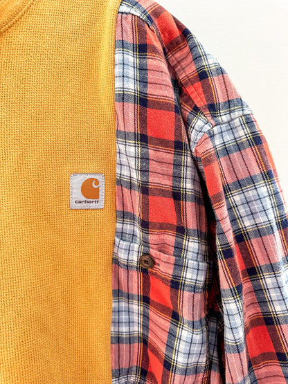 A carhartt flannel shirt with a patch on it.