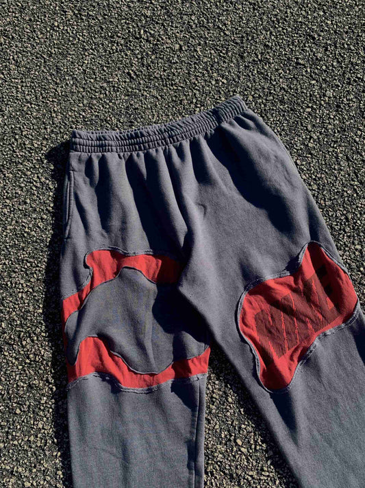 a pair of blue and red pants laying on the ground.