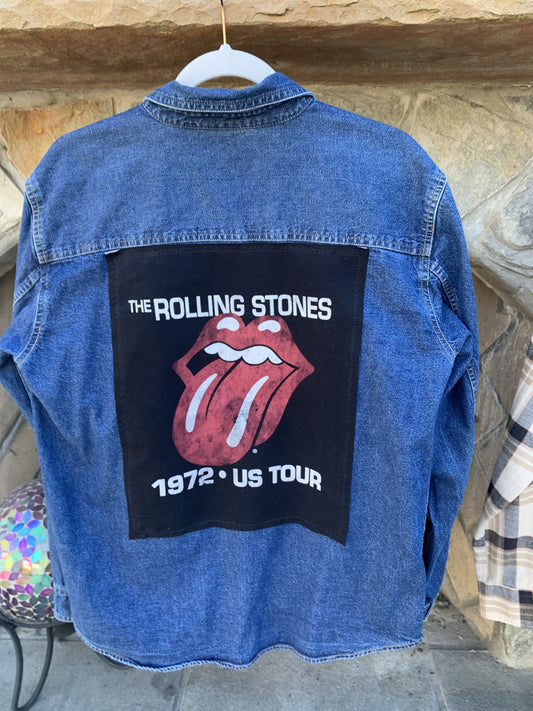 a denim jacket with the rolling stones on it.