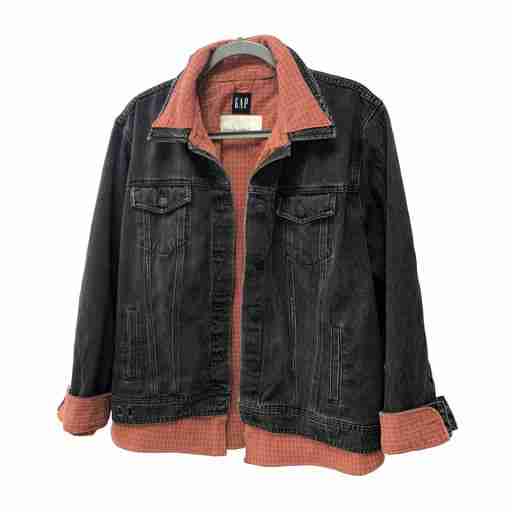 a black jacket with an orange collar.