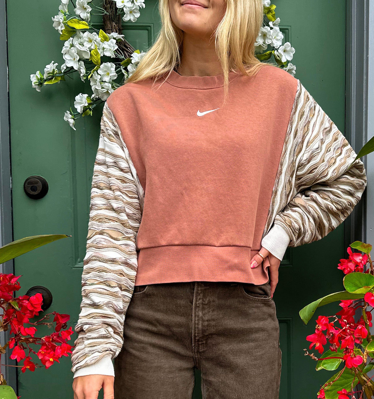Nike cropped sweatshirt in tan and brown.