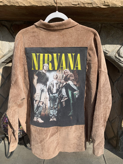 A Nirvana Corduroy Jacket with a picture of Nirvana on it.