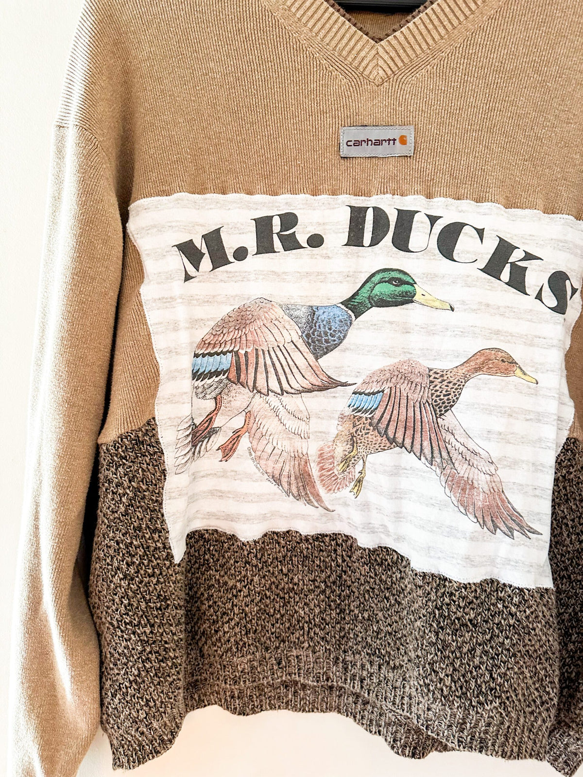 A sweater with the words mr ducks on it.