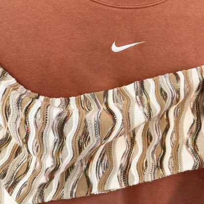 A nike sweatshirt with a striped pattern on it.