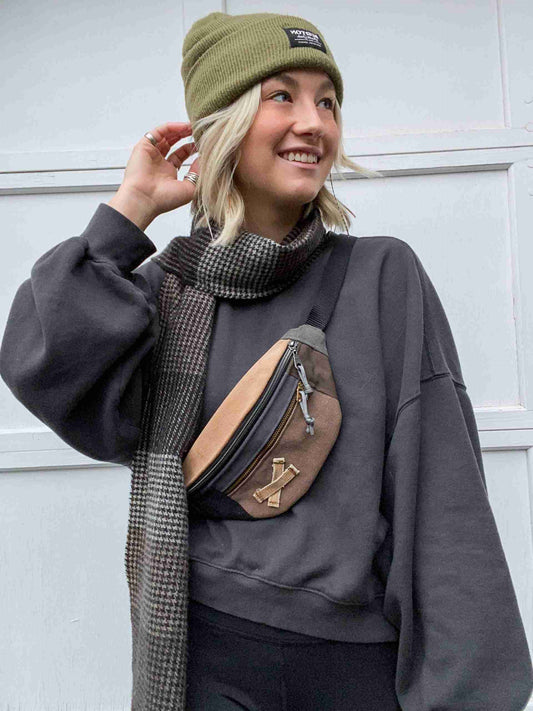 a woman wearing a green hat and scarf.