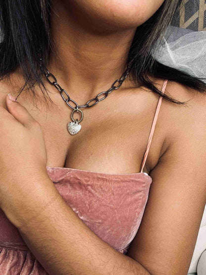 a close up of a person wearing a necklace.