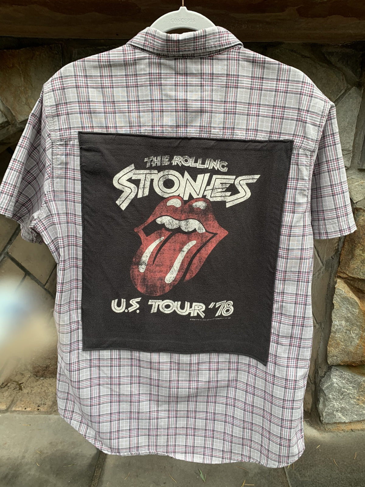 a button up shirt with a picture of the rolling stones on it.