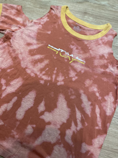 A red and yellow Roxy tie dye cut-out tee with the word joy on it.
