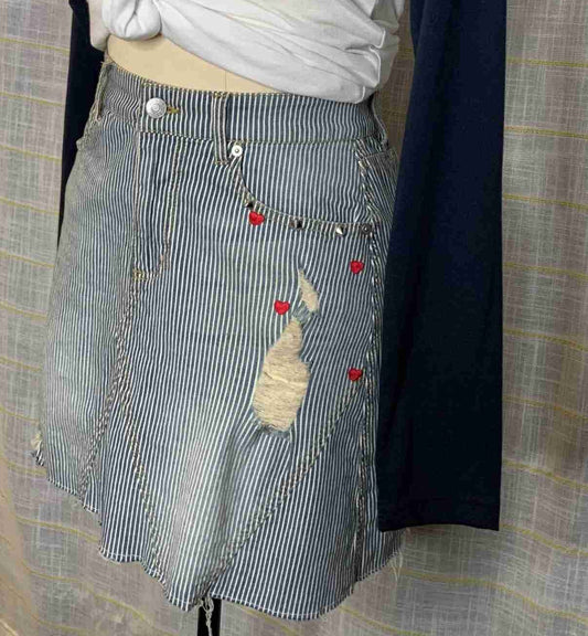 a mannequin wearing a skirt with a heart on it.