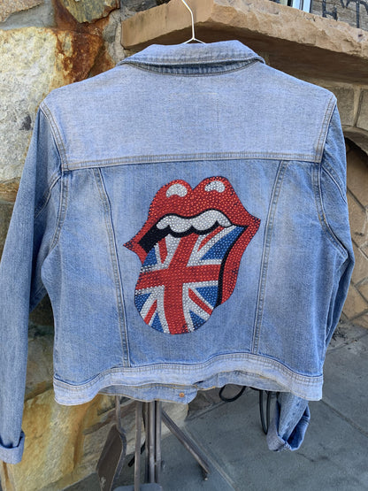 A Rolling Stones denim jacket with the British flag on it.
