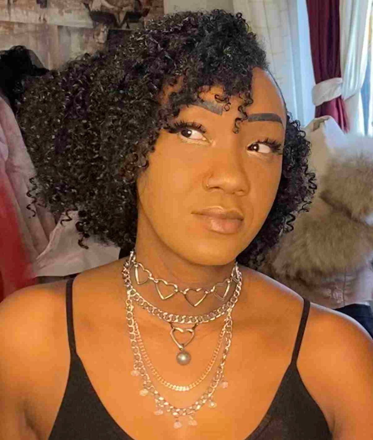 a mannequin with a necklace and a necklace on it's neck.