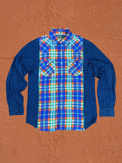 a blue and orange plaid shirt hanging on a wall.
