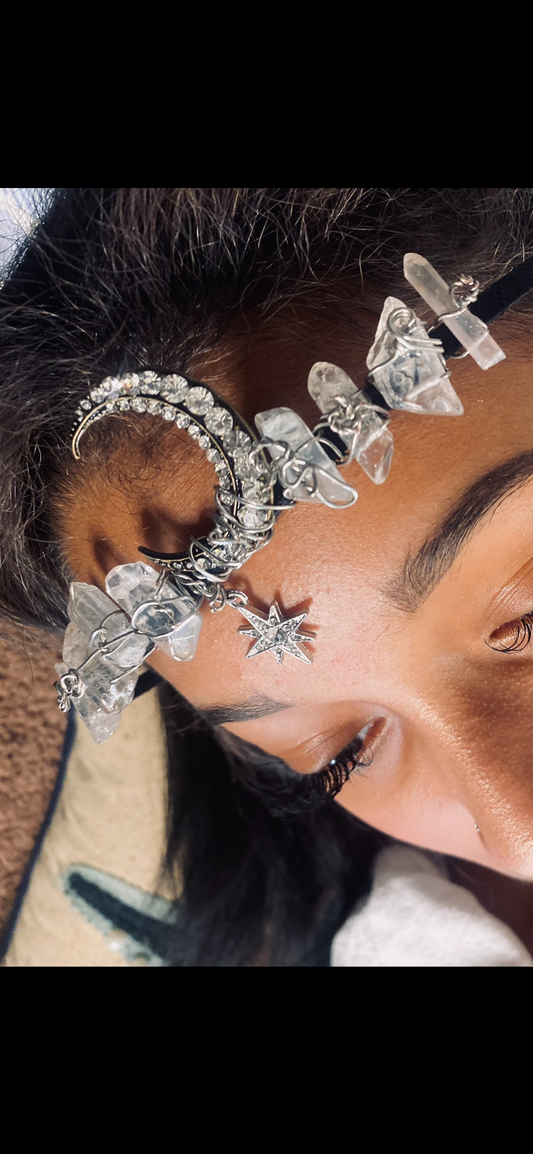a woman wearing a head piece made of crystal stones.