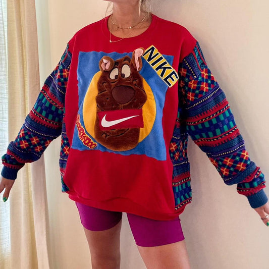 A woman wearing a sweater and shorts.