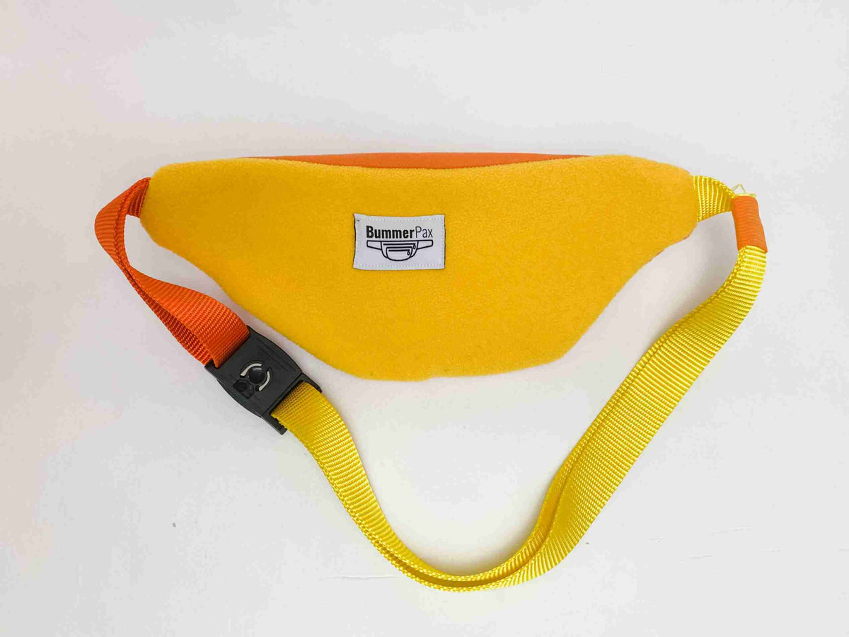a yellow belt with a black buckle on it.