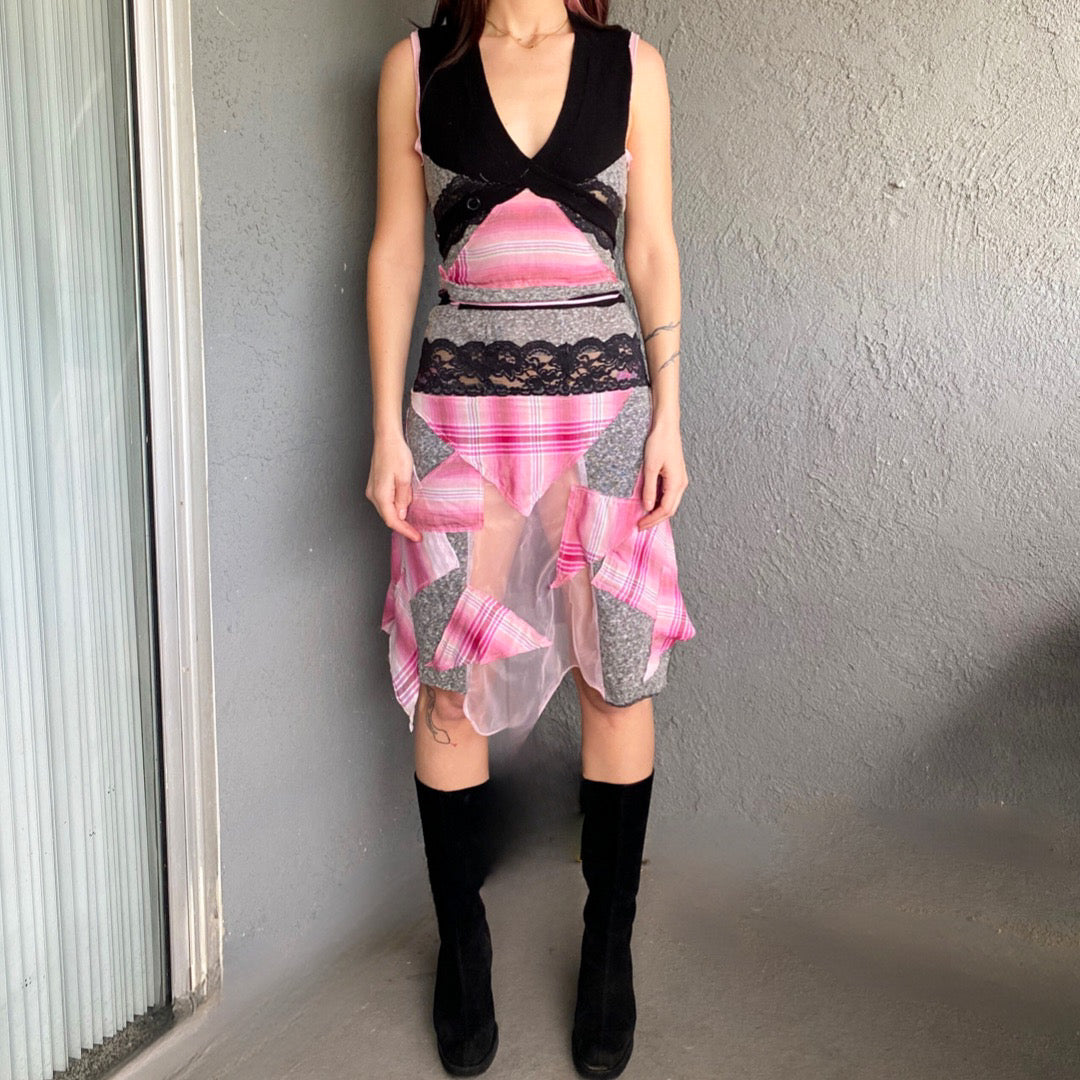 A woman wearing a pink and black dress.