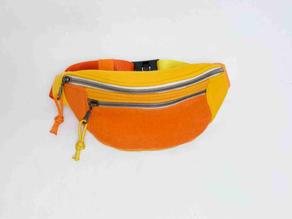 a yellow fanny bag with a zipper on the side.