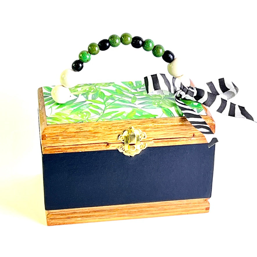 Cigar box purse with palm leaf print, zebra ribbon embellishment and beaded handle