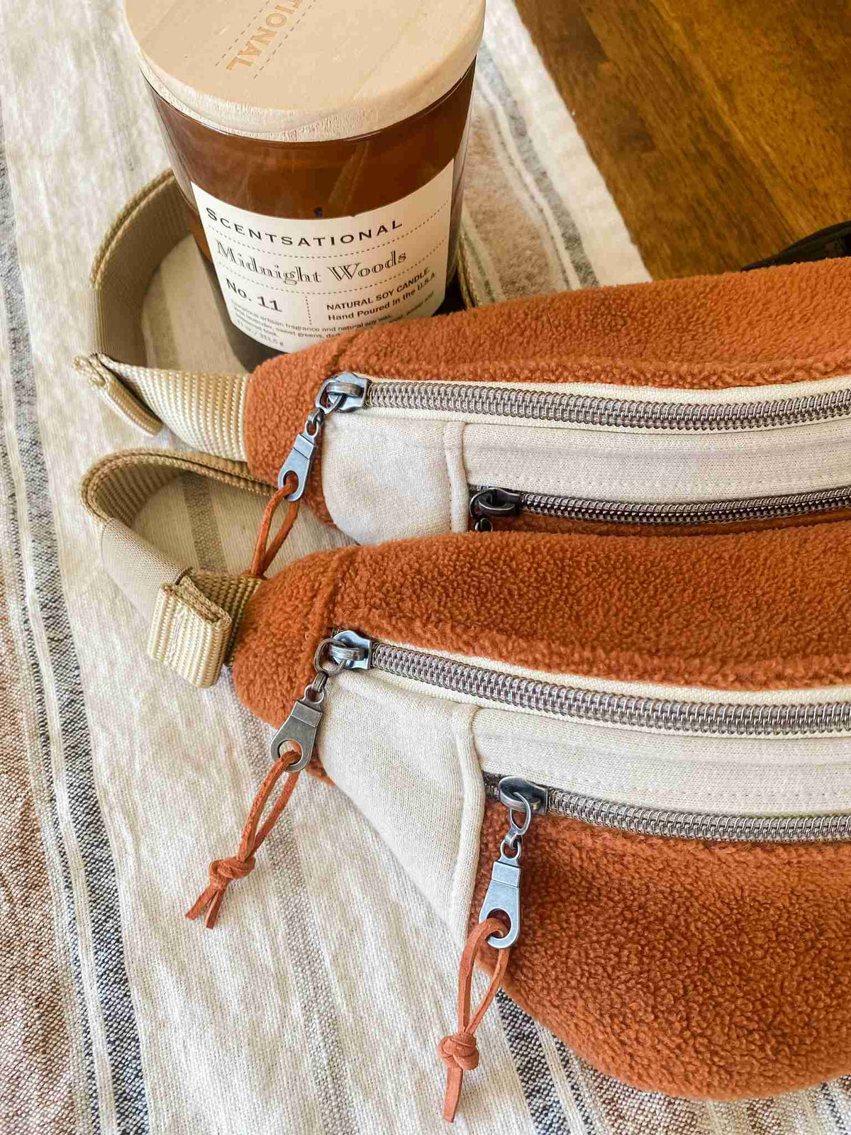 a pair of zippered purses sitting on top of a table.