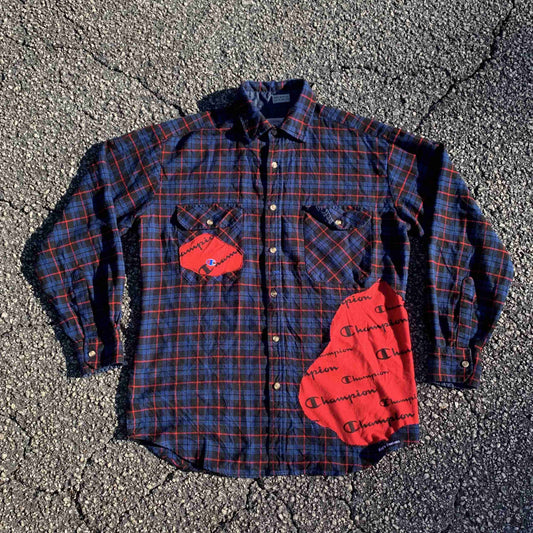 a plaid shirt with a heart patch on it.