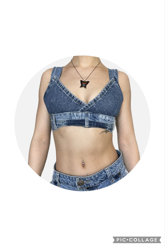 A woman wearing a Denim Bralette Top and jeans shorts.
