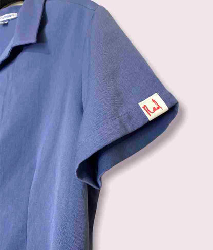 a blue shirt with a label on it.