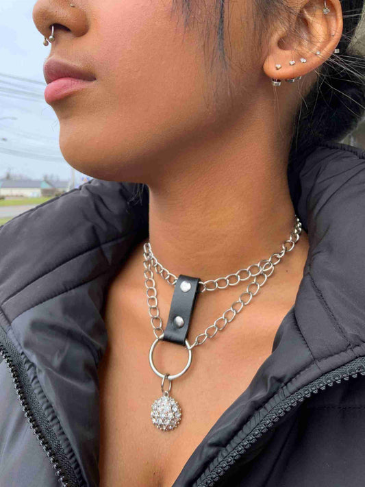 a close up of a person wearing a necklace.