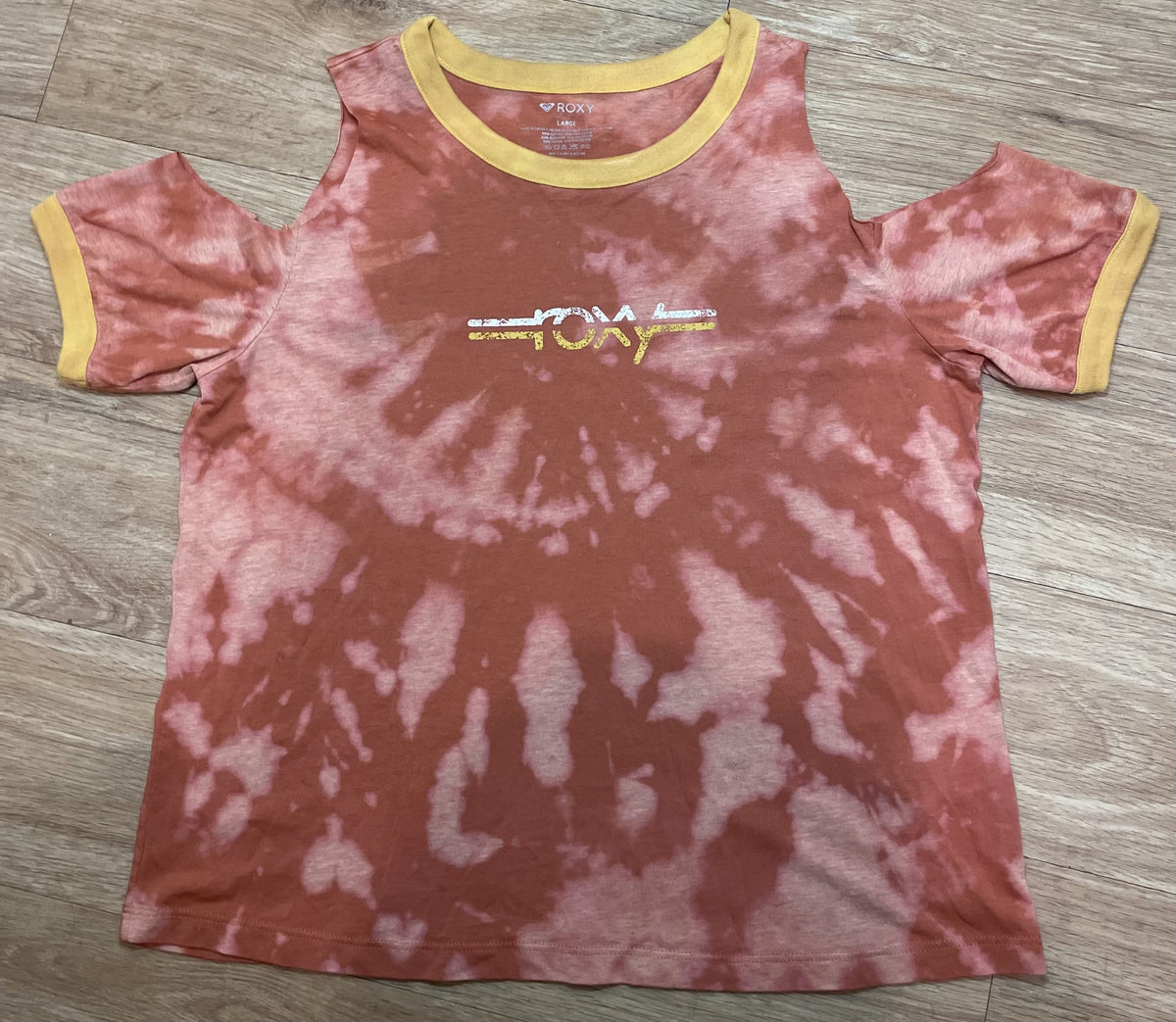 a Roxy tie dye cut-out tee with a white and yellow logo.