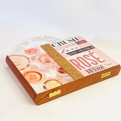 A wood Rosé wine purse with glass bead handle