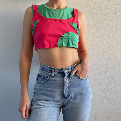 A woman wearing a 1of1 pink and mint tee tank top.