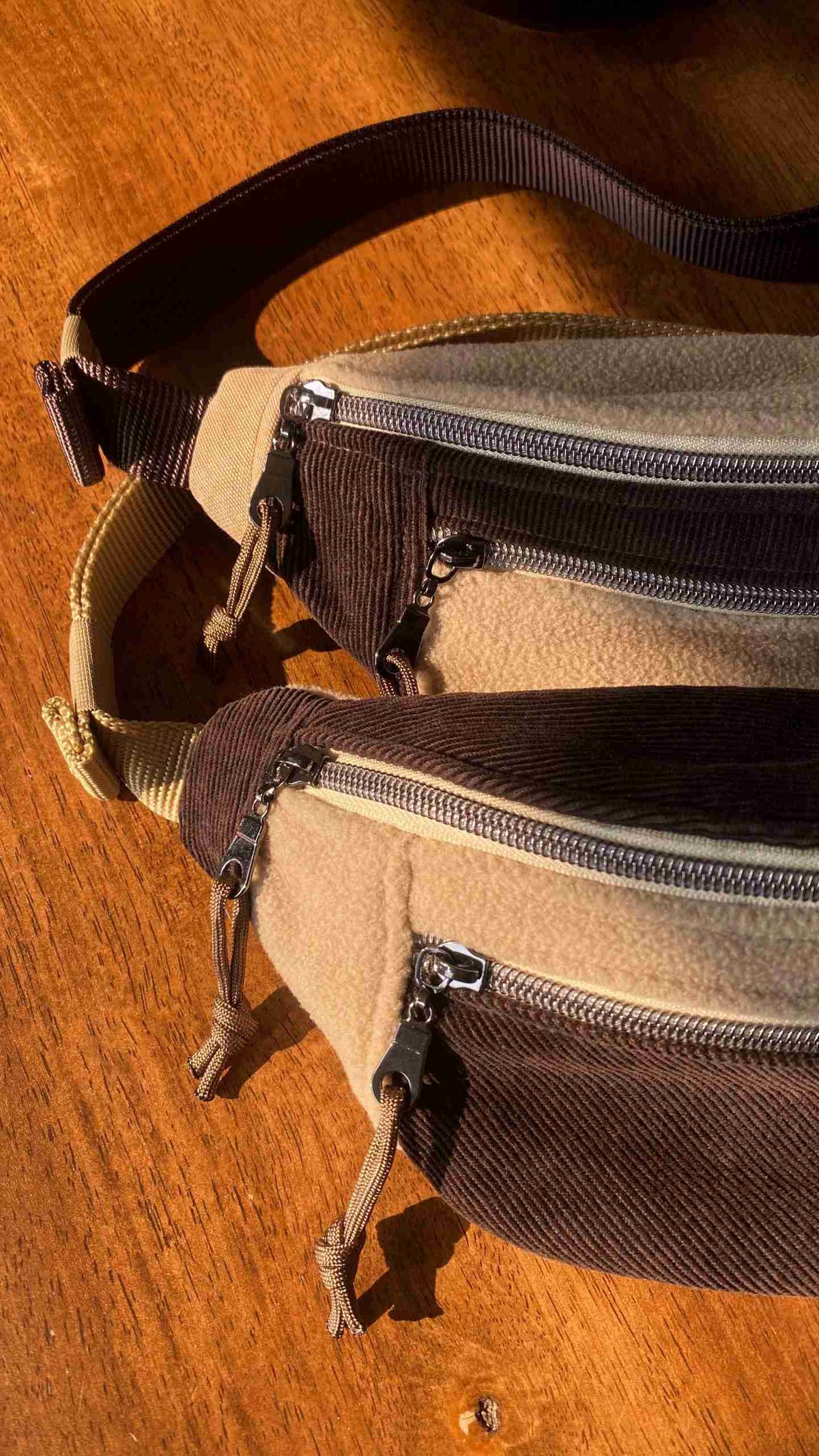 a couple of bags sitting on top of a wooden table.
