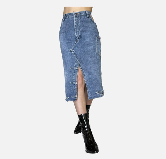 A woman wearing a Denim midi skirt with slit and cutouts.
