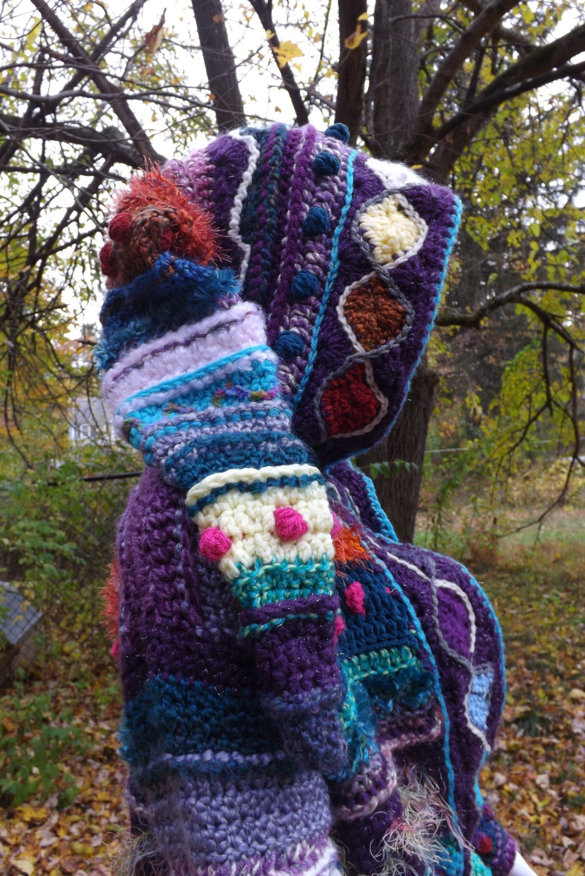 A colorful crochet coat with elf hood