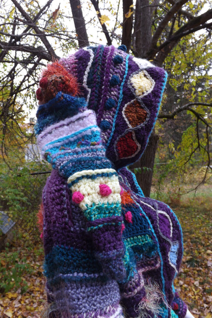 A colorful crochet coat with elf hood