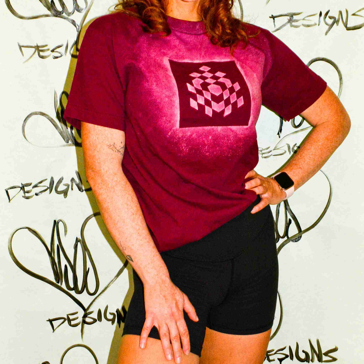 a woman posing for a picture with her hands on her hips.