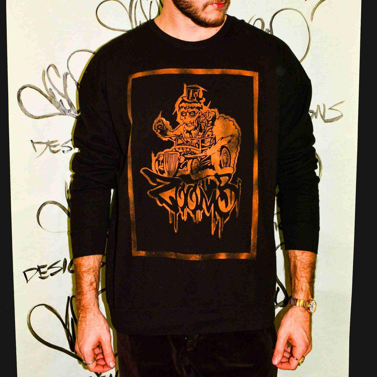 a man with a beard wearing a black shirt.