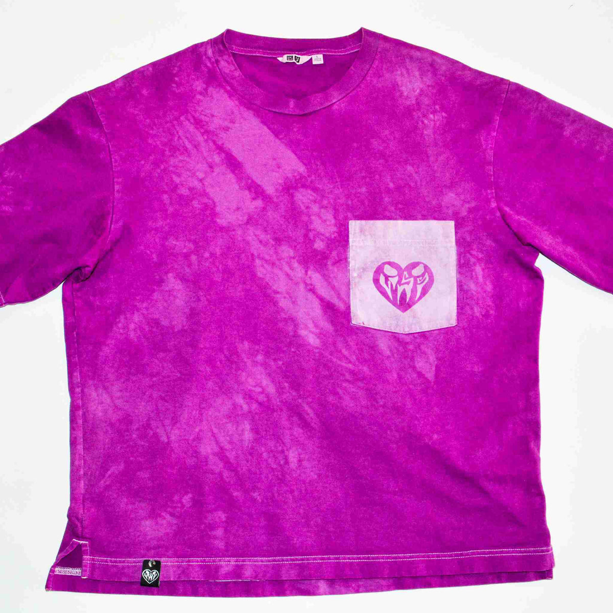 a purple shirt with a heart in the pocket.