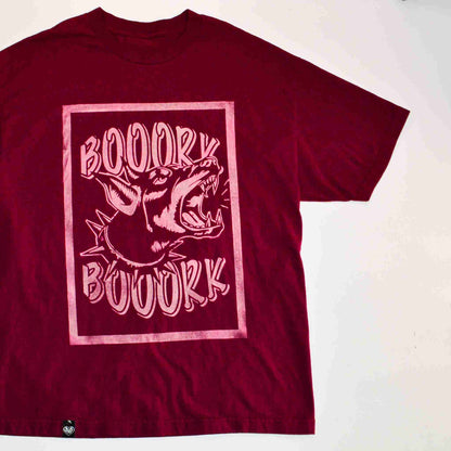 a red shirt with a picture of a shark on it.