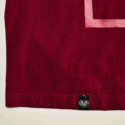 a red towel with a white square on it.