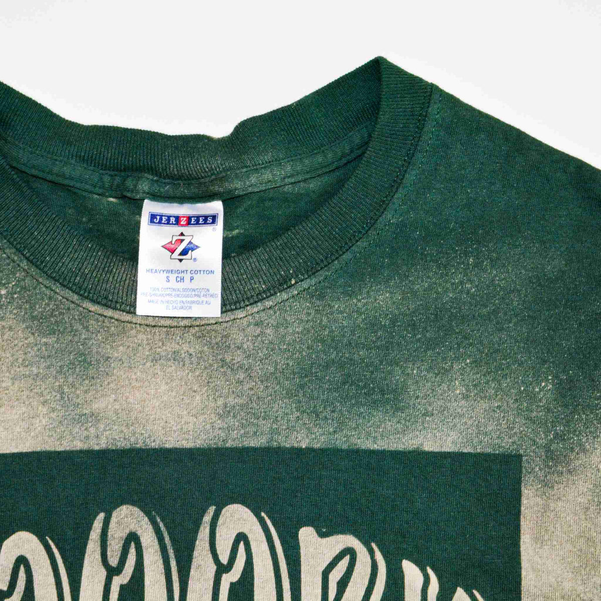 a close up of a shirt with a tag on it.